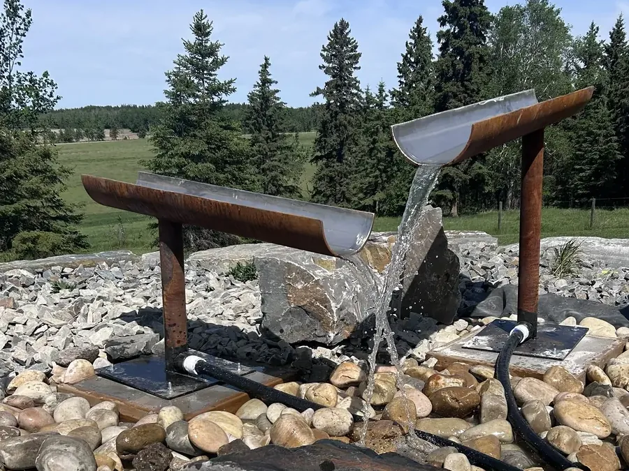 Custom Corten steel water feature with twin spill troughs