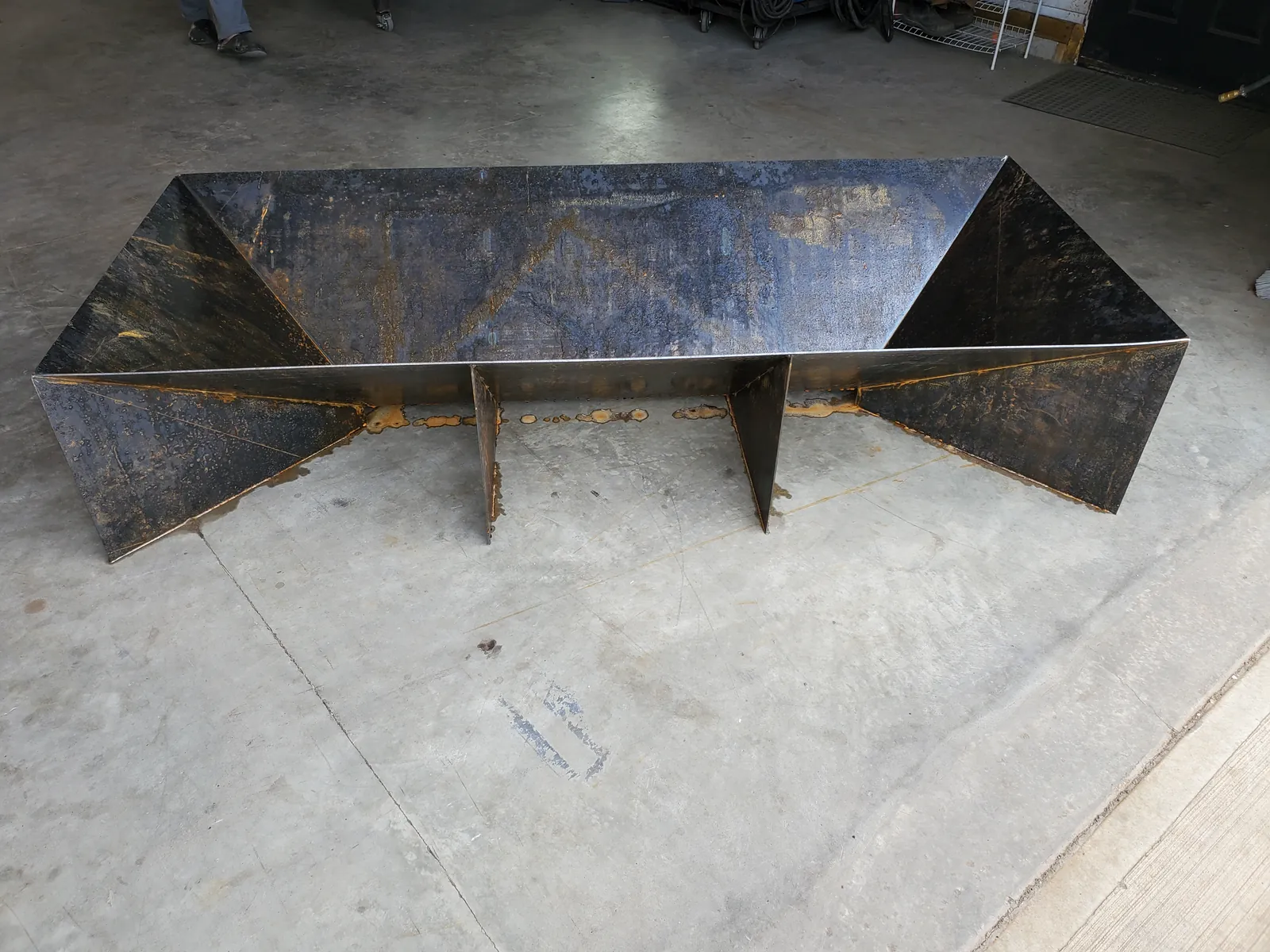 Faceted steel fire pit, full view of the folded plate form