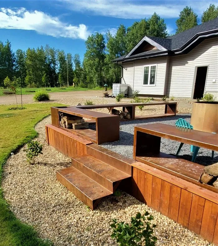 Corten firewood benches with cedar steps and integrated wood storage