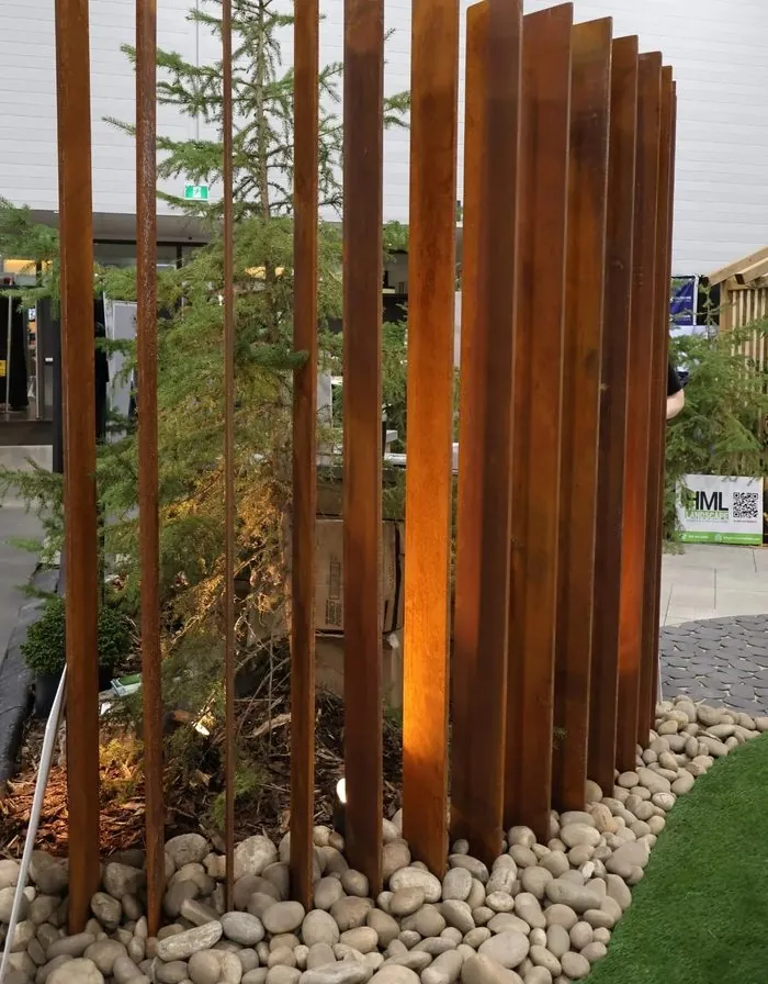 Corten steel vertical-slat screen at the Home & Garden Show booth