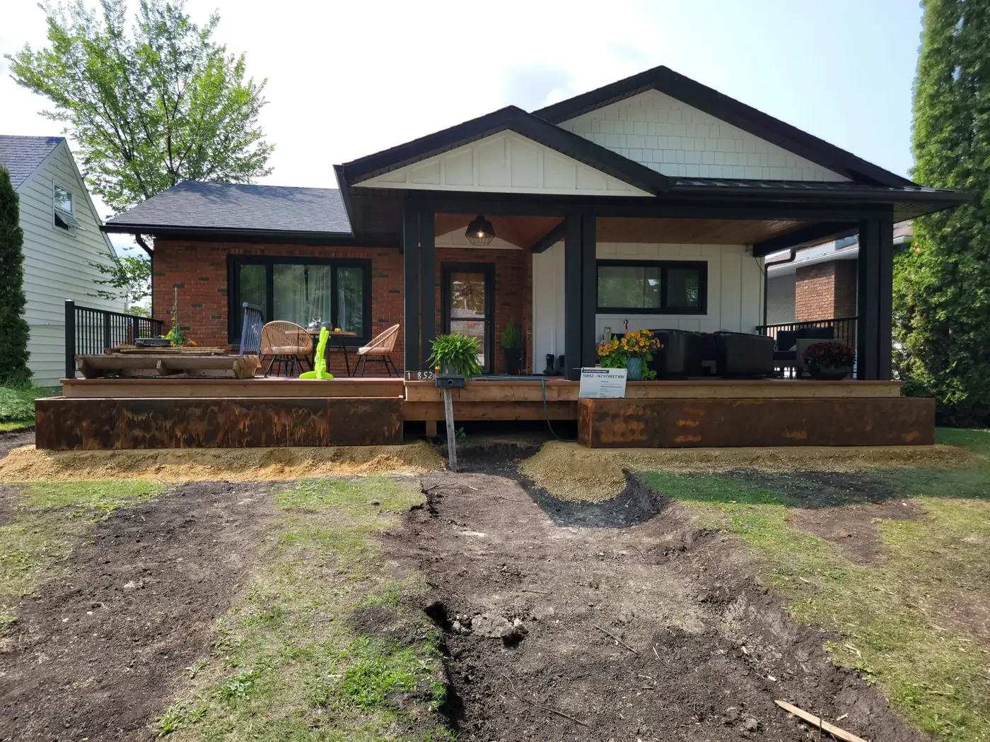 Front elevation of the Corten porch planter installation during construction